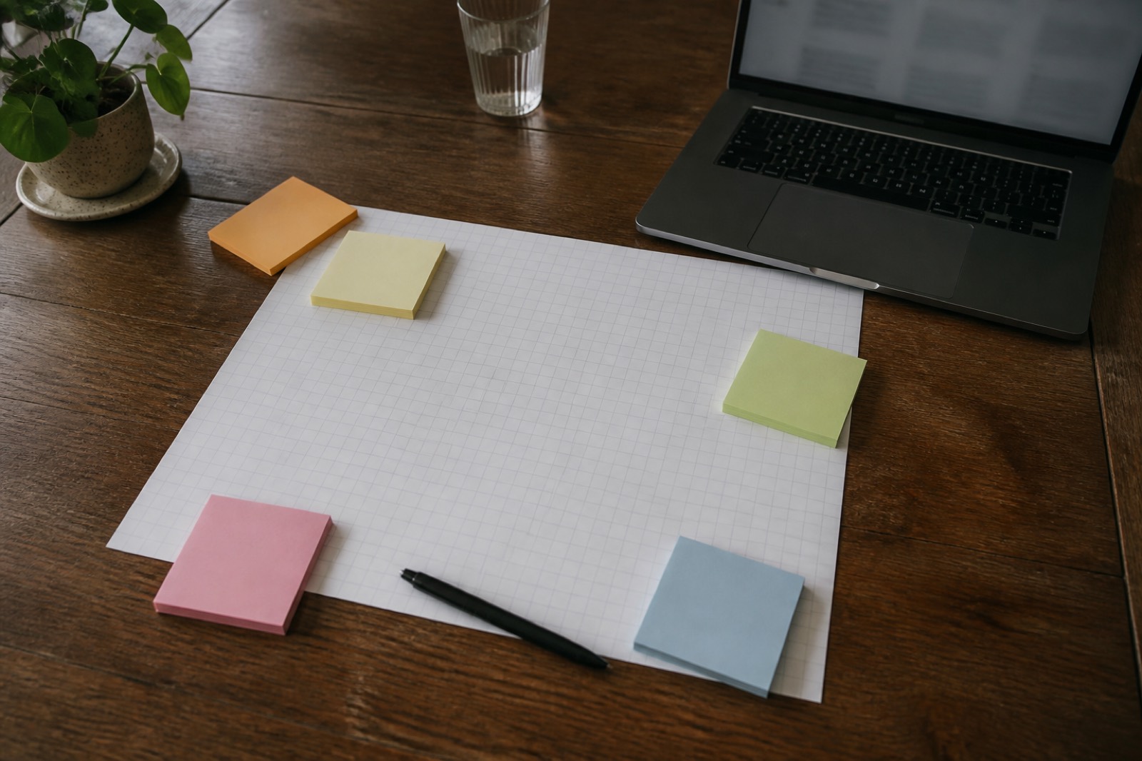 Planning grid and sticky notes for an acquisition project plan template