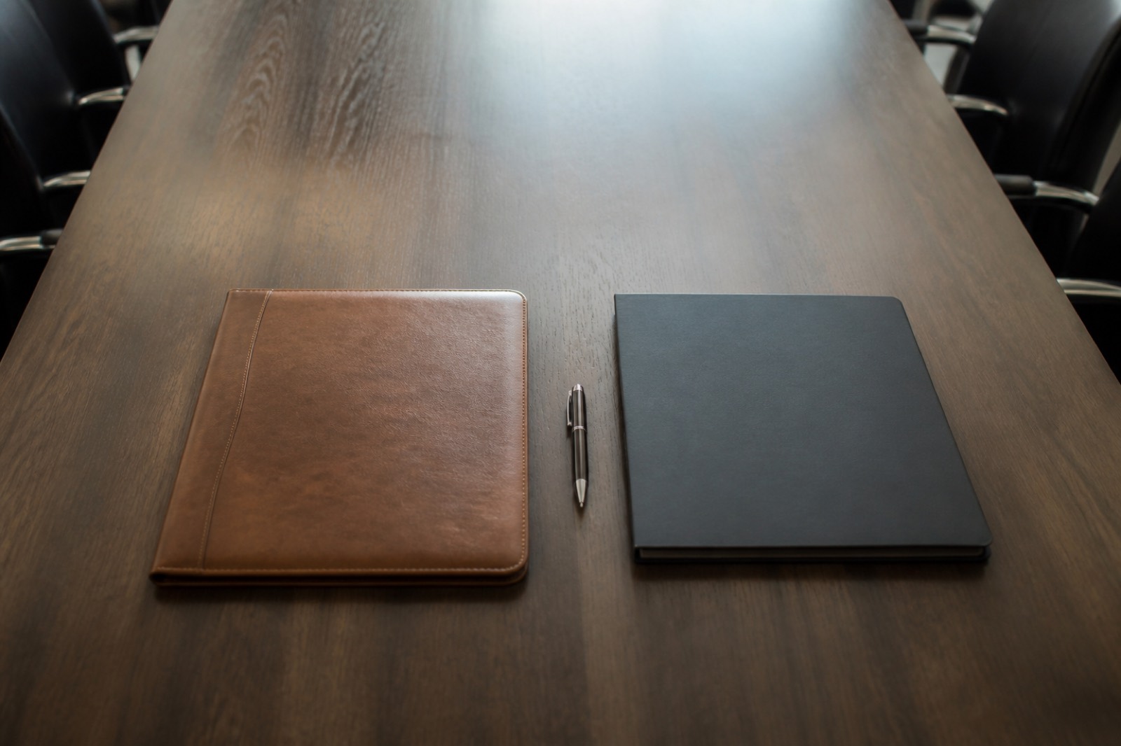 Two folders comparing family office private equity buyers side by side