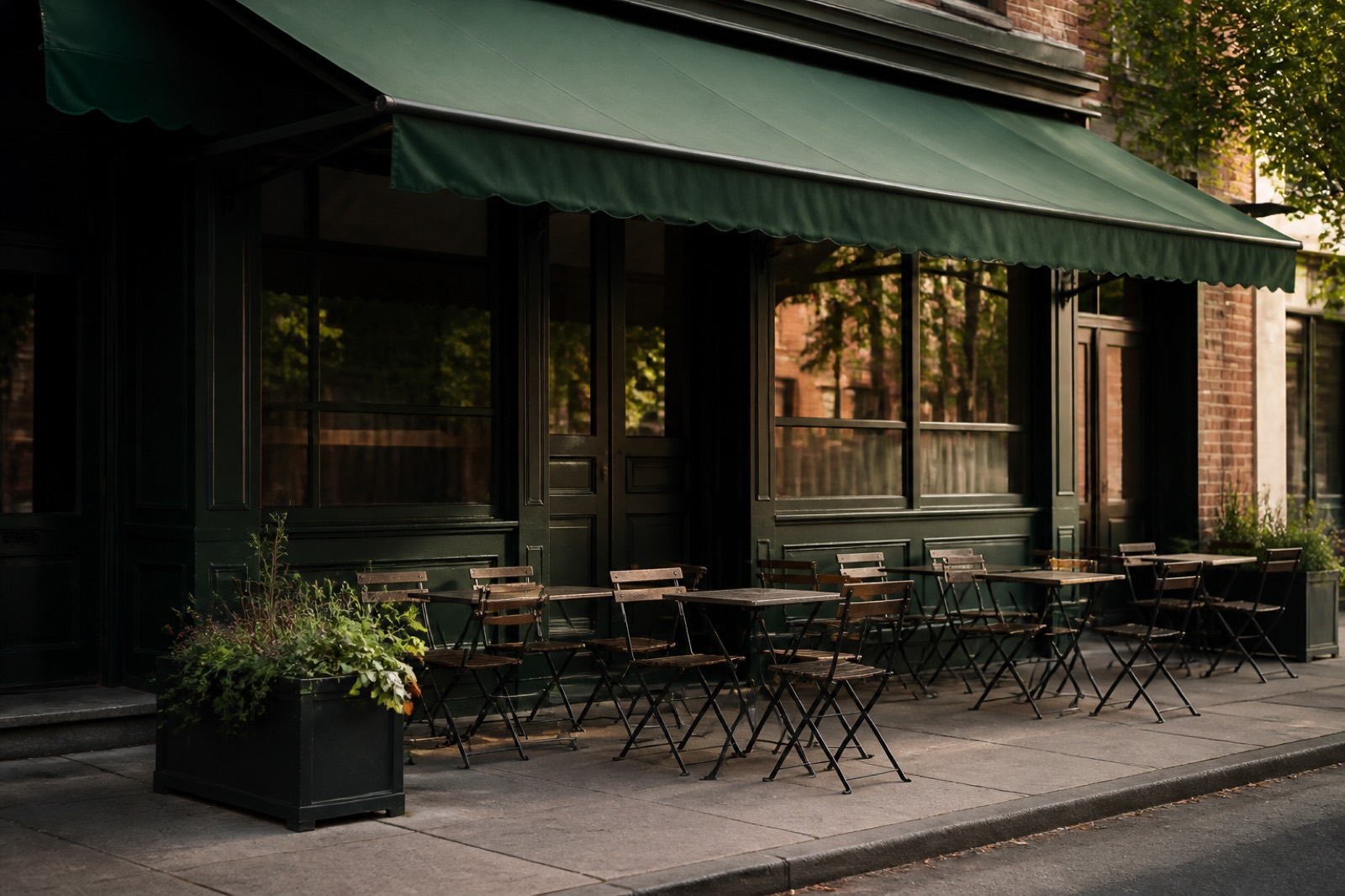 Small restaurant storefront with an awning and empty patio