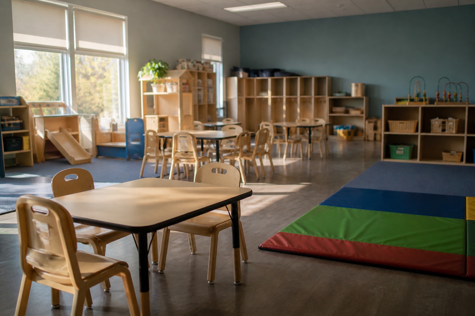 Daycare classroom with small tables, the kind buyers want when you sell a daycare business