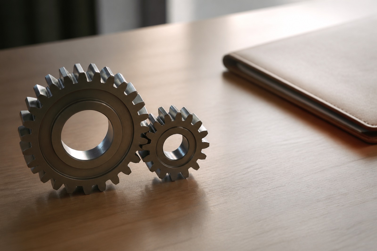 Meshing gears showing the two main types of M&A synergy capture